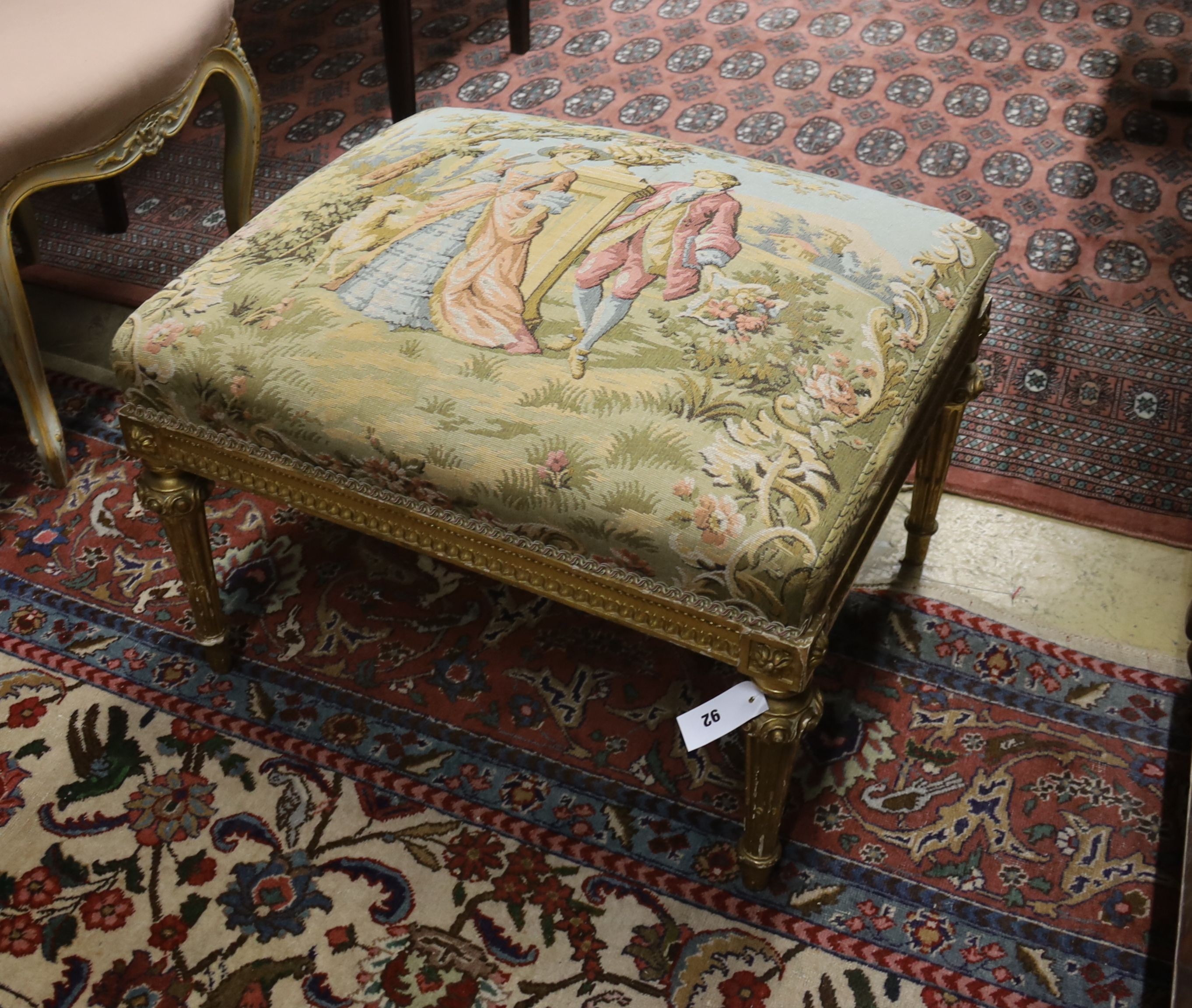 An 18th century style rectangular giltwood dressing stool with tapestry seat